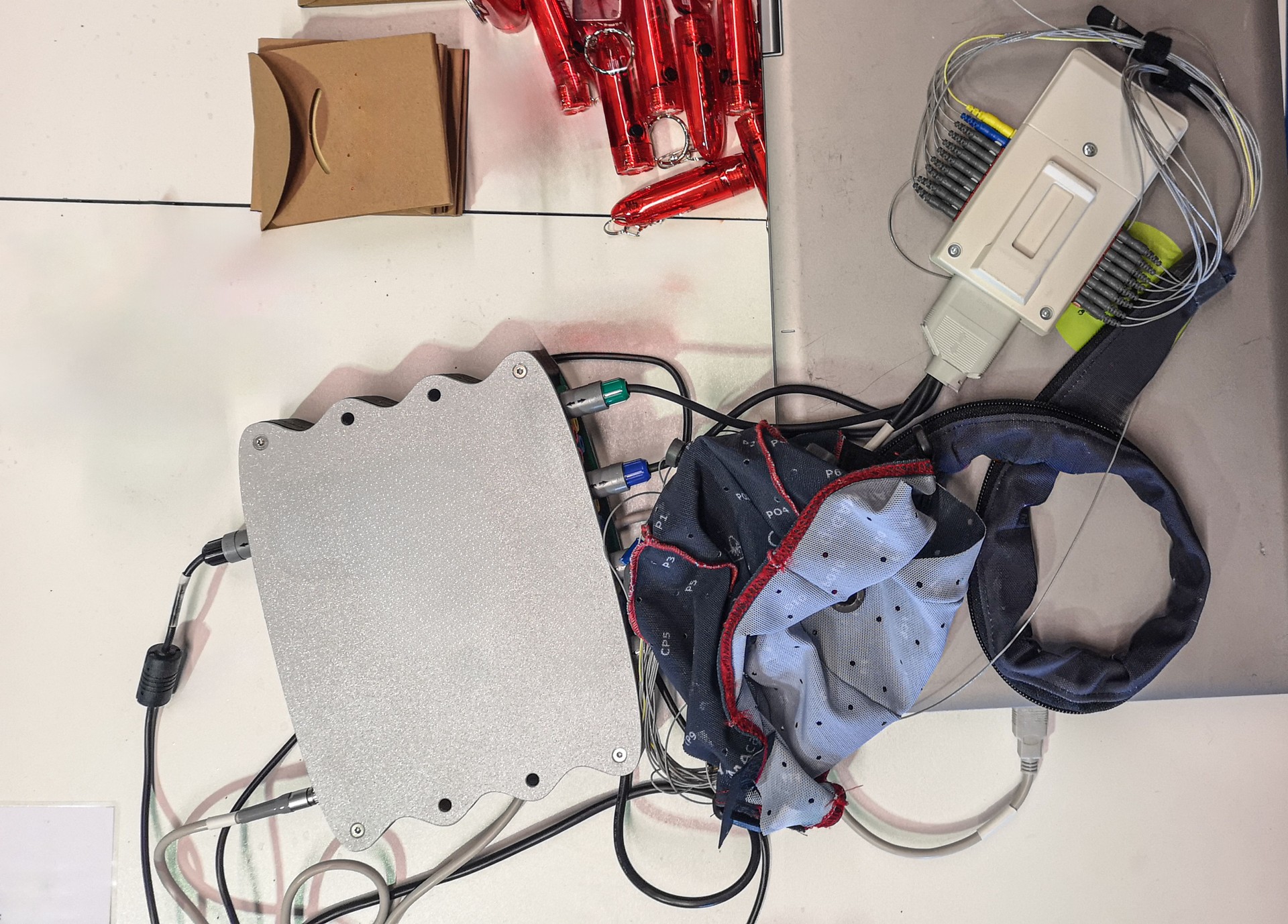 Complex bci electronics setup with cables and devices.